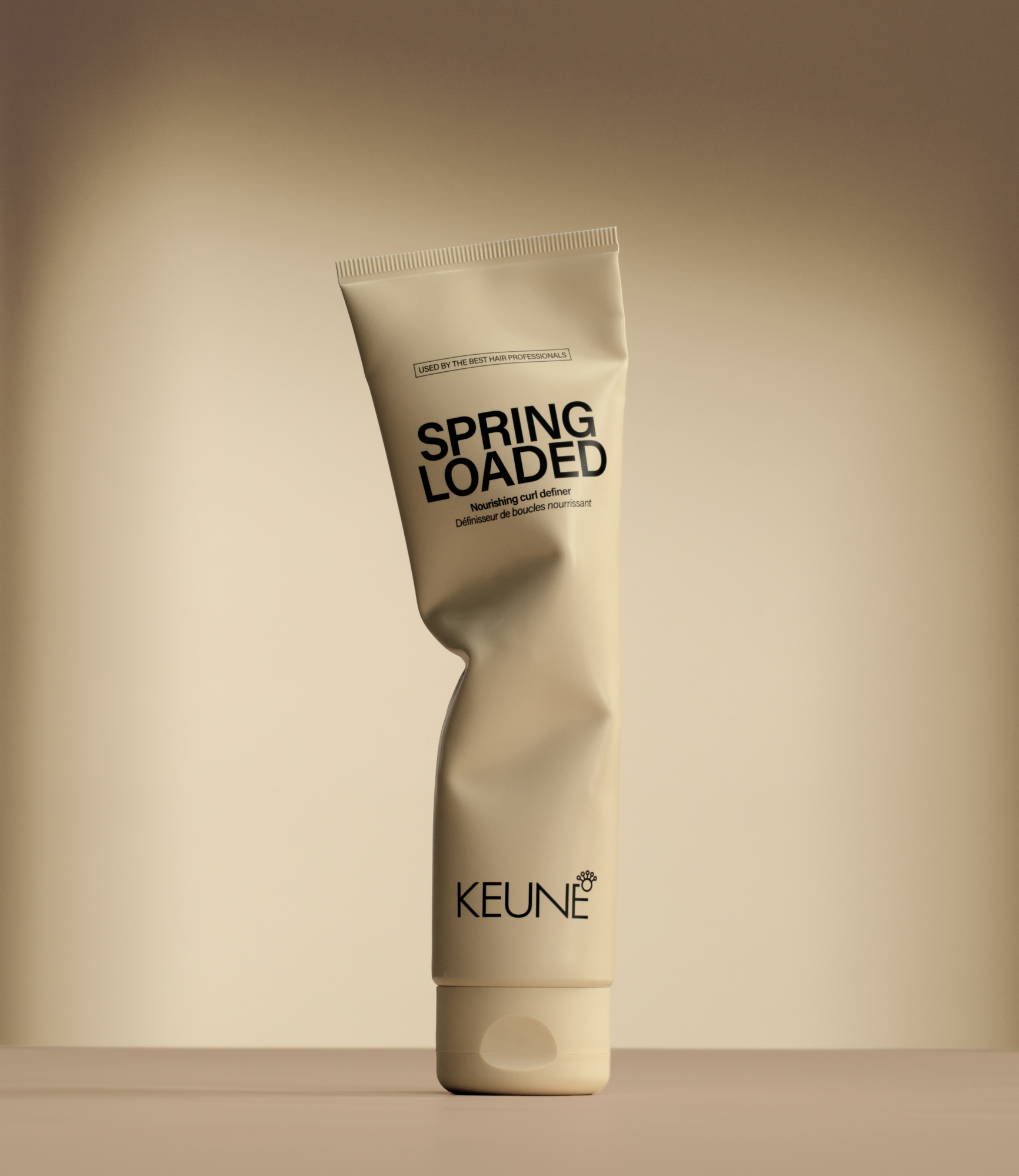 Achieve beautifully defined curls with Keune Spring Loaded Nourishing curl definer. Combines cream nourishment and gel hold for flawless curly hair.